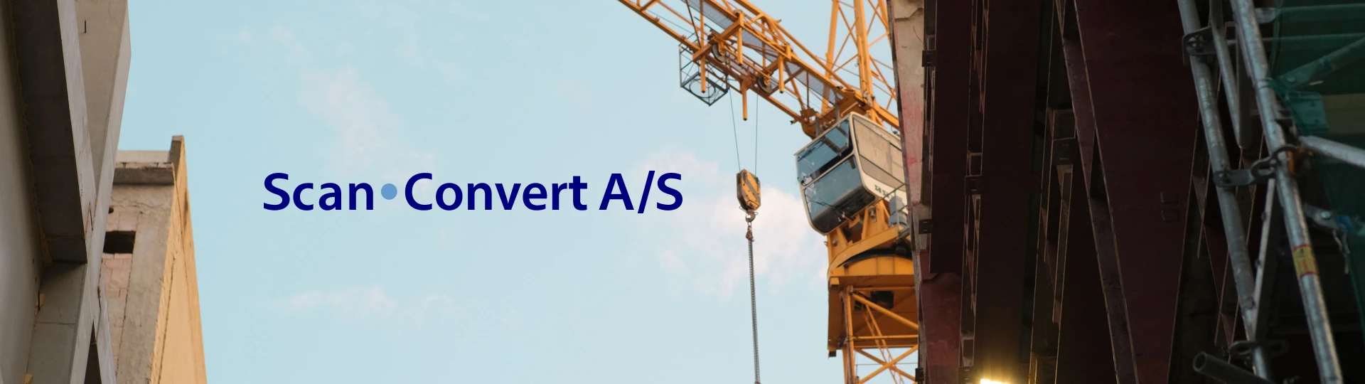 Industrial construction scene with the Scan-Convert wordmark